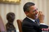 美国华盛顿，美国总统奥巴马在一次会议中大笑。