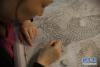 在江苏南京市云锦博物馆，一名织工在设计云锦图案纹样（9月26日摄）。新华社记者 朱唯希 摄