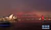 2月1日晚，澳大利亚悉尼海港大桥点亮红色照明，迎接中国农历新年。新华社记者 白雪飞 摄