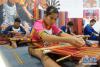 6月8日在广州市城市规划展览中心拍摄的的非遗“黎族传统纺染织绣技艺”展示。 新华社发（许建梅摄）