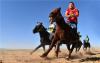 10月1日，在内蒙古巴彦淖尔市乌拉特后旗骆驼文化旅游节上，牧民赛手参加蒙古马场地赛。