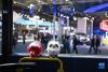 11月7日在第四届进博会汽车展区拍摄的“冰墩墩”和“雪容融”。新华社记者 孟涛 摄